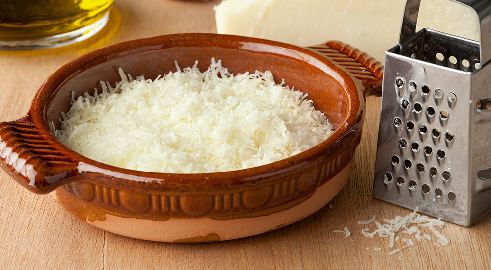 Image of a bowl with grated Italian pecorino romano cheese.