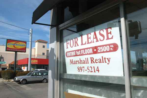 for lease sign in the window of a restaurant facility