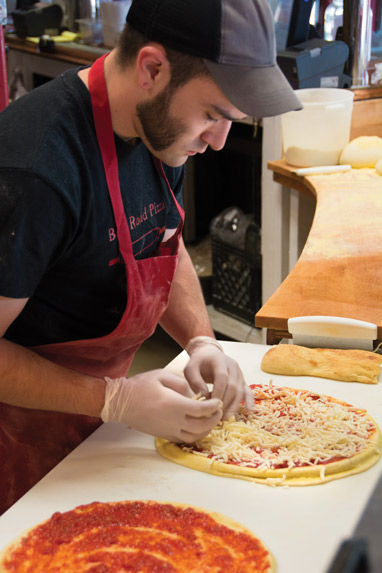 pizzaiolo making pizza