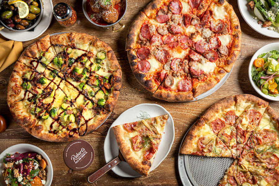 table full of pizza, Robert's Pizza and Dough Company, Chicago Illinois, on the Chicago River