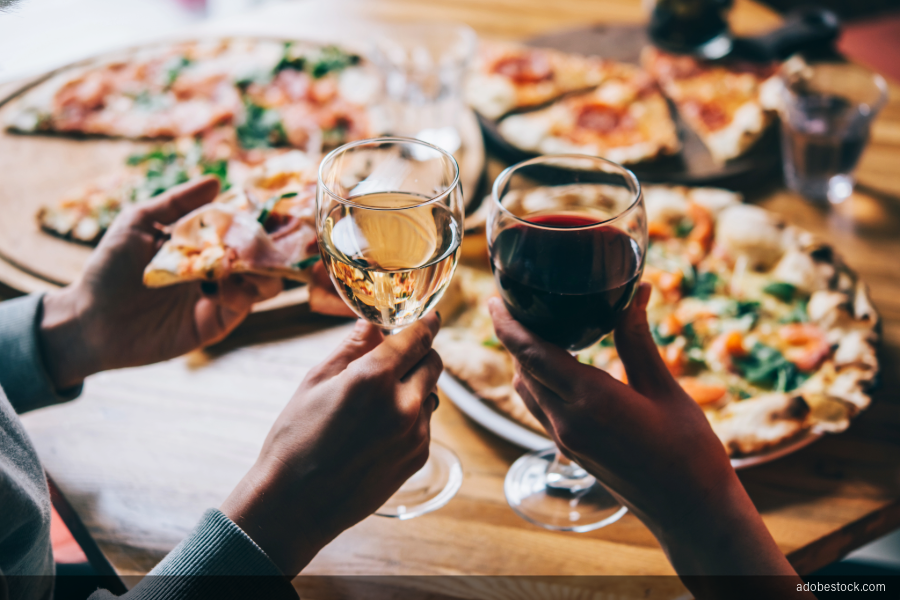 Image of toast with wine glasses and pizza