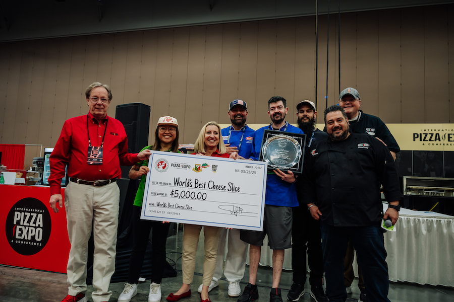 Chris Ostapenko of Slice on Broadway, Pittsburgh, Pennsylvania wins World's Best Cheese Slice at International Pizza Challenge at Pizza Expo in Las Vegas.