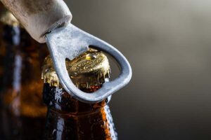Image of cold beer being opened.