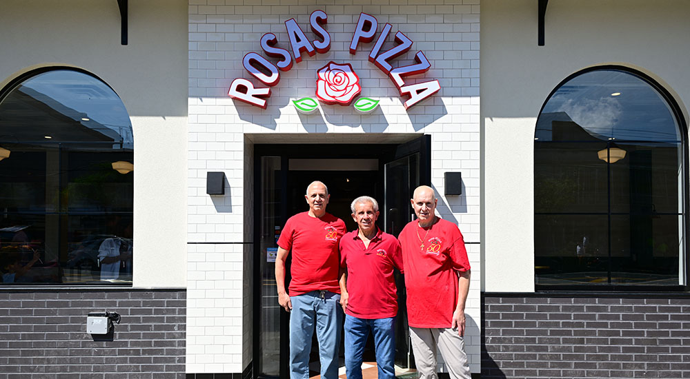 Image of brothers Charlie, Joe and John Troia celebrating the 50th anniversary of Rosa's Pizza.