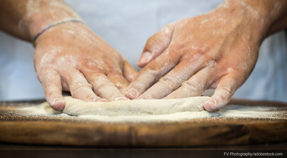 Image of hands kneading dough