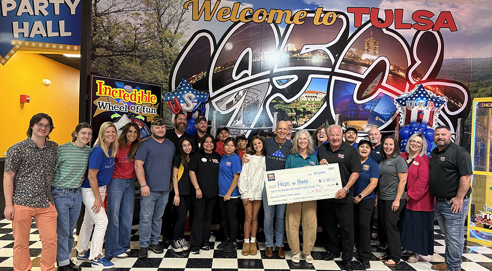 America's Incredible Pizza Co. presents a check to Folds of Honor, which provides educational assistance to the children of fallen servicemembers.