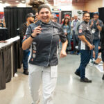 Image of Nicole Bean running to accept first prize at The Great American Pizza Challenge.