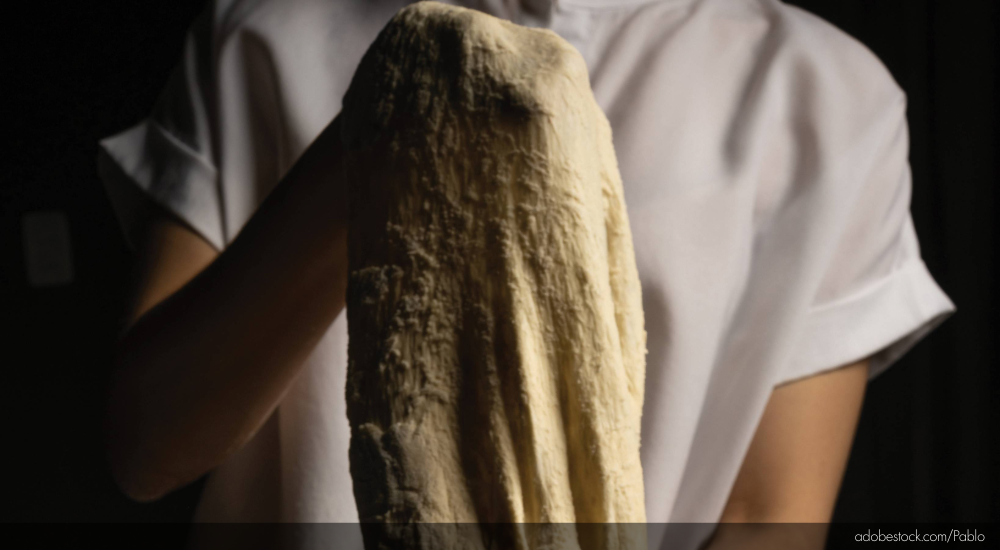 stretching pizza dough