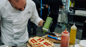 Image of pizzaiolo conducting a demo at Pizza Expo