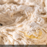 Image of unincorporated dough being mixed in a bowl.