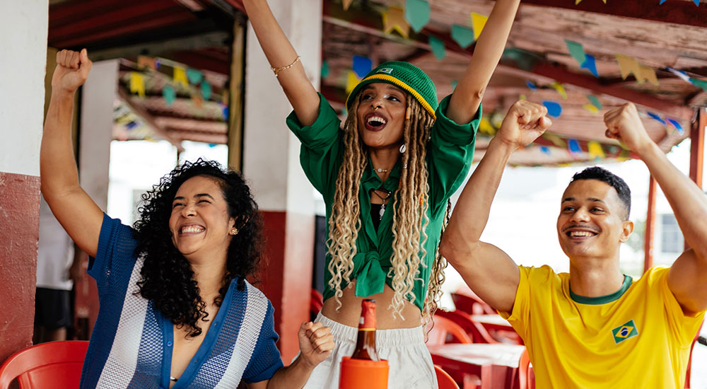 Image of Brazilian fans cheering their sports team.