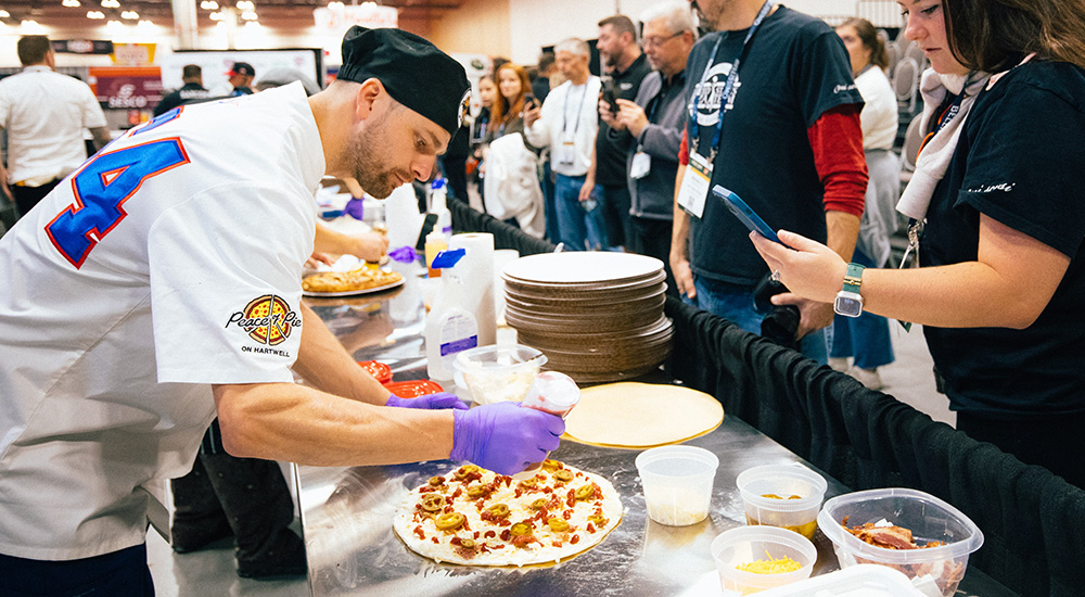Image of a competitor making pizza during the Great American Pizza Challenge in Columbus, Ohio.